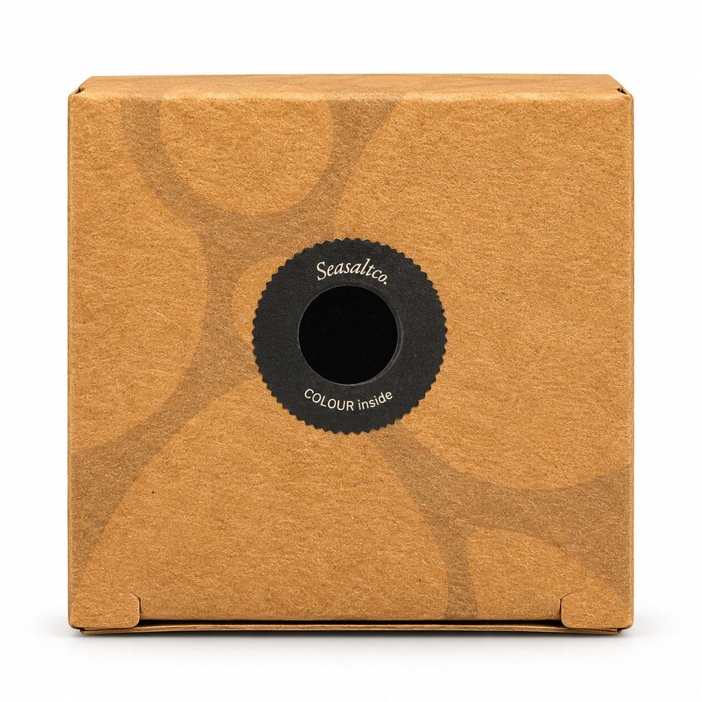 Seasaltco black hair powder in a square brown cardboard box with a circular label on the front.
